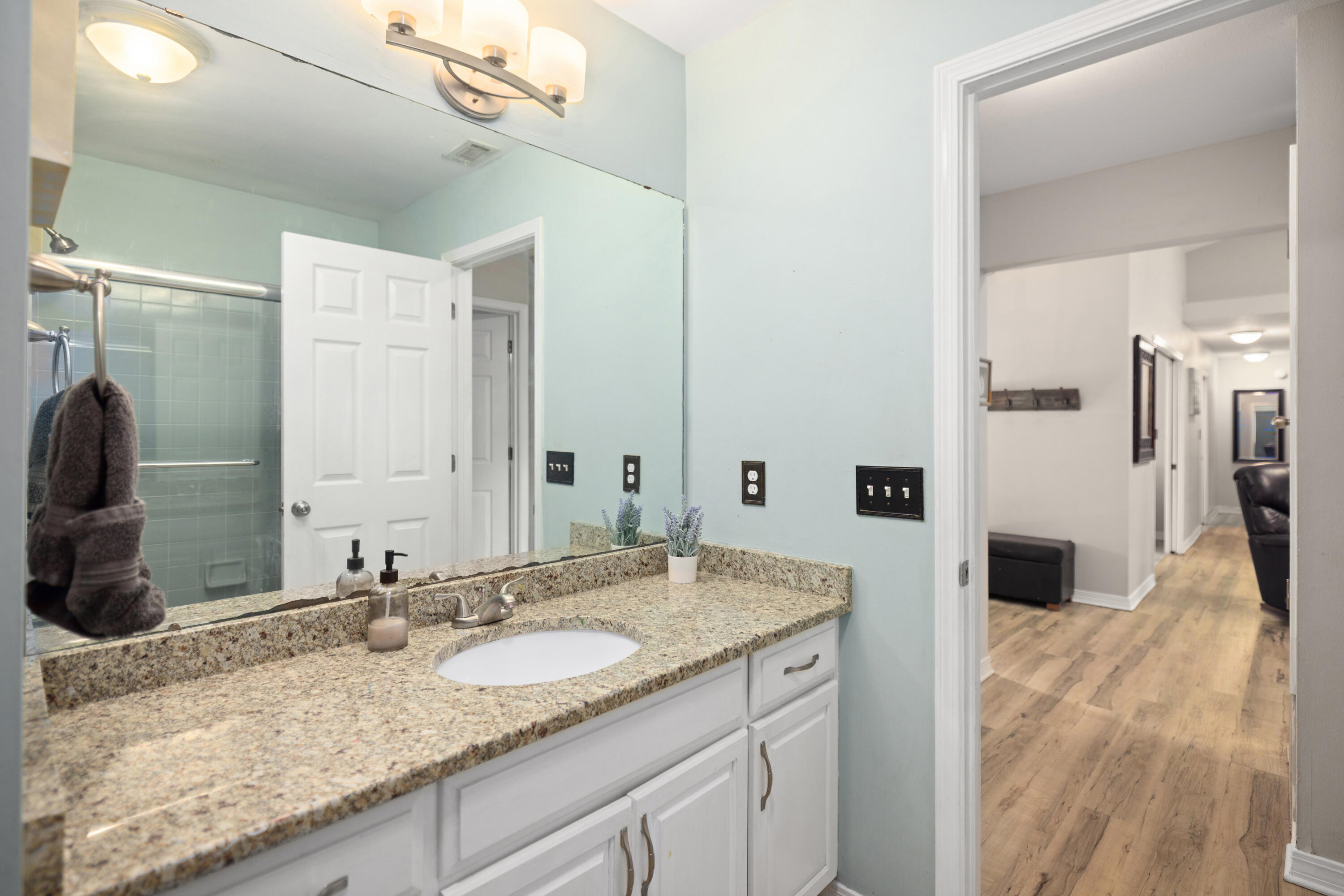 314 Ruckel Drive Niceville, FL 32578 - Photo 41 of 66 a bathroom with a granite countertop sink and a mirror