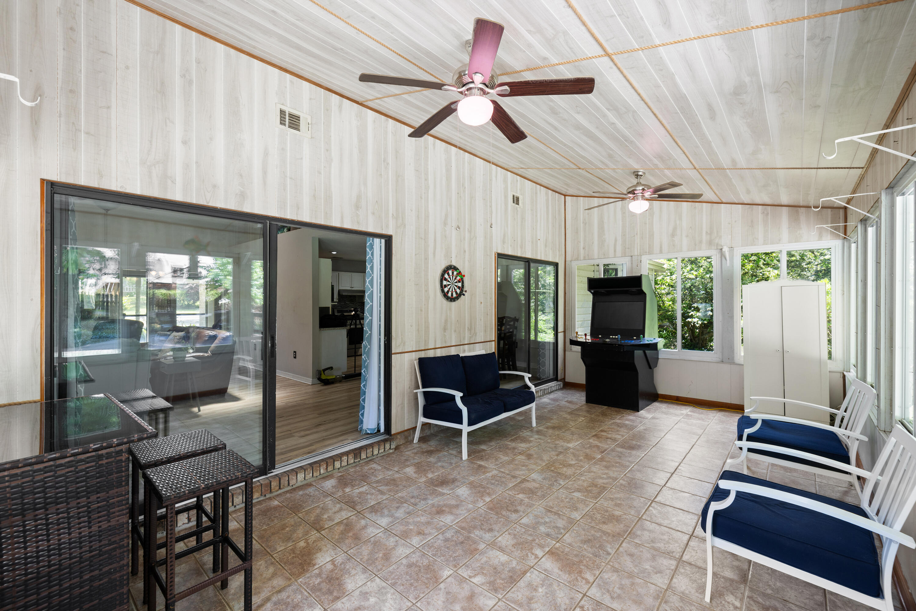 314 Ruckel Drive Niceville, FL 32578 - Photo 46 of 66 a living room with furniture a flat screen tv and a window
