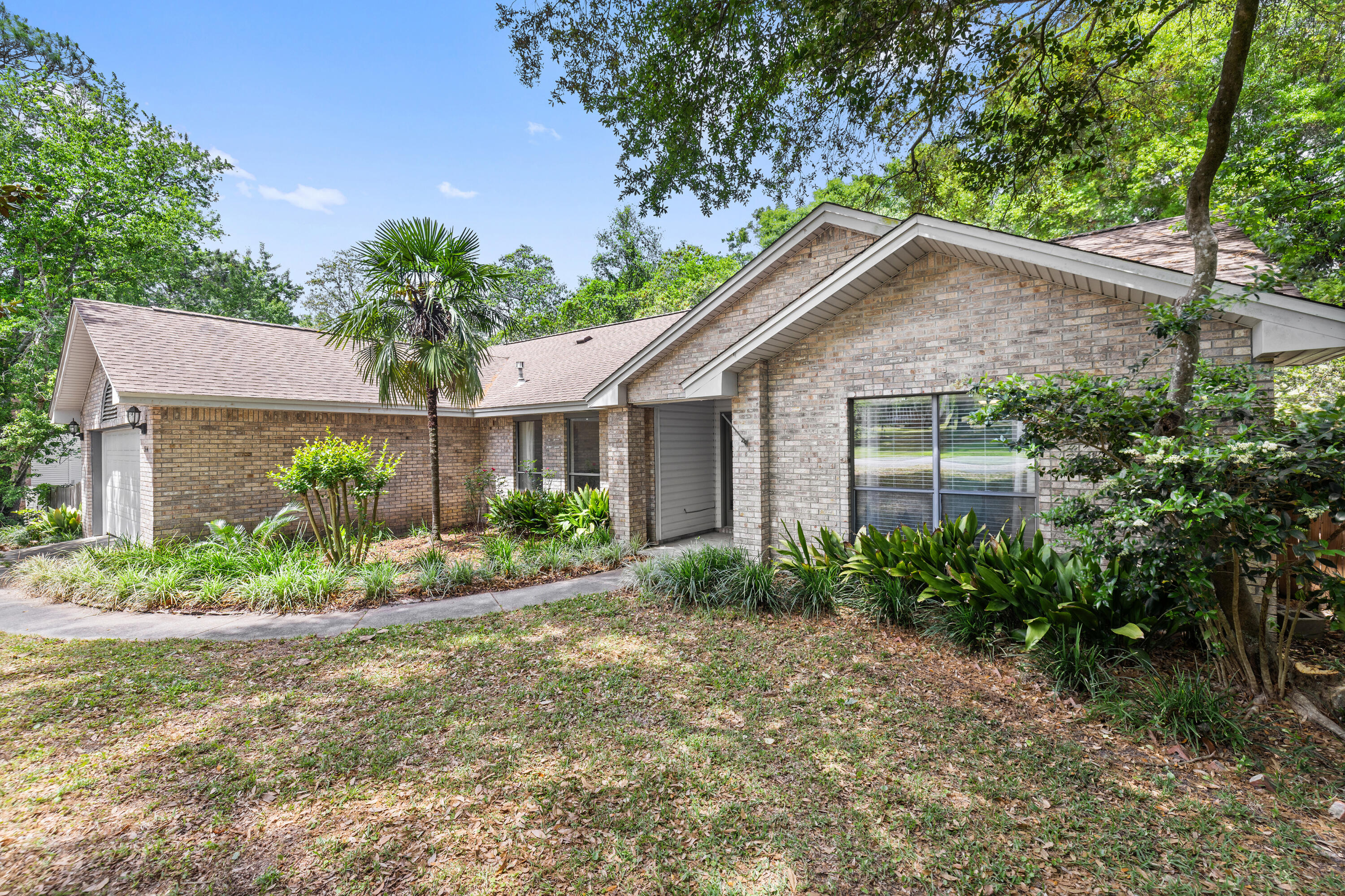 314 Ruckel Drive Niceville, FL 32578 - Photo 5 of 66 a front view of a house with garden