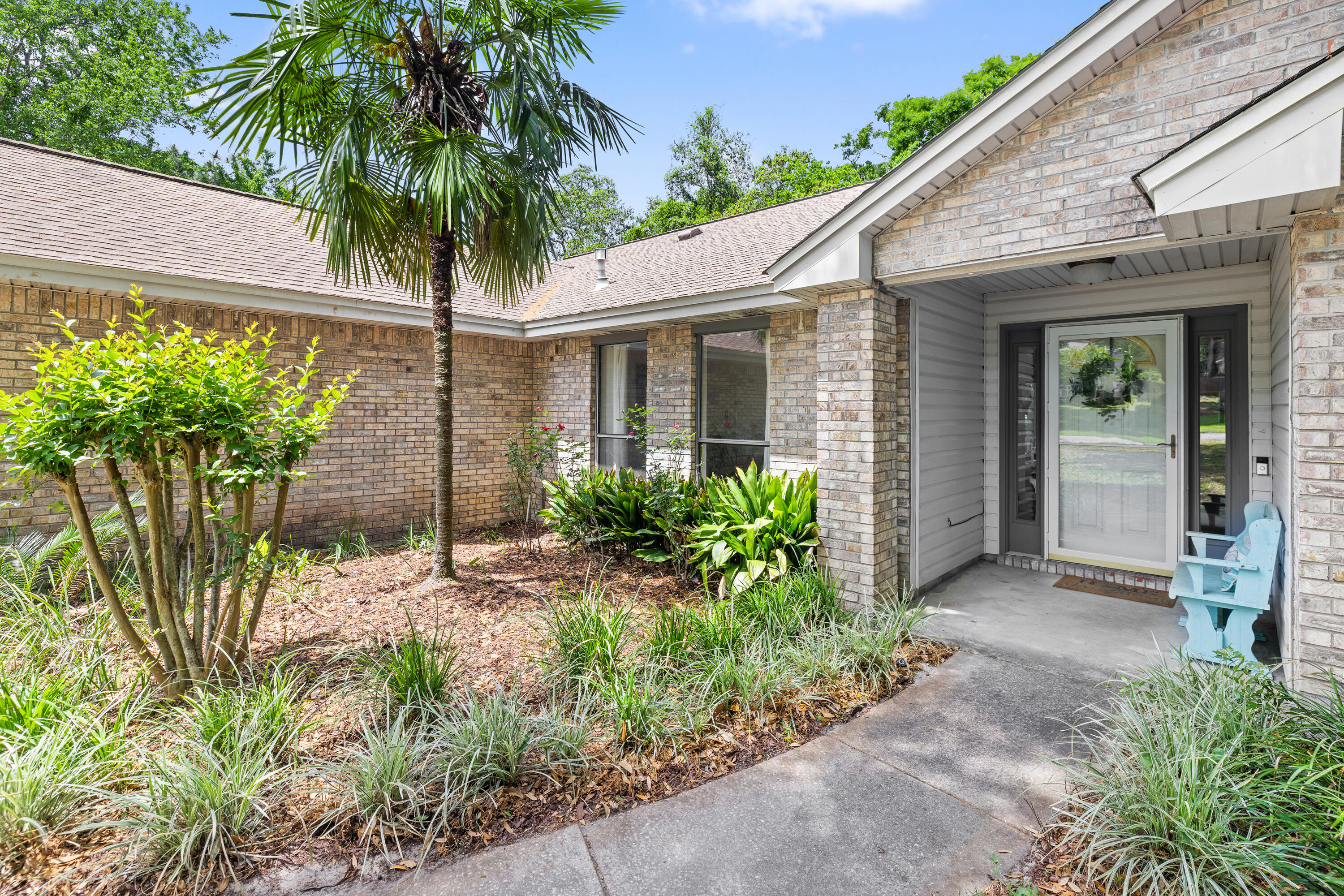 314 Ruckel Drive Niceville, FL 32578 - Photo 7 of 66 a couple of potted plants in front of house