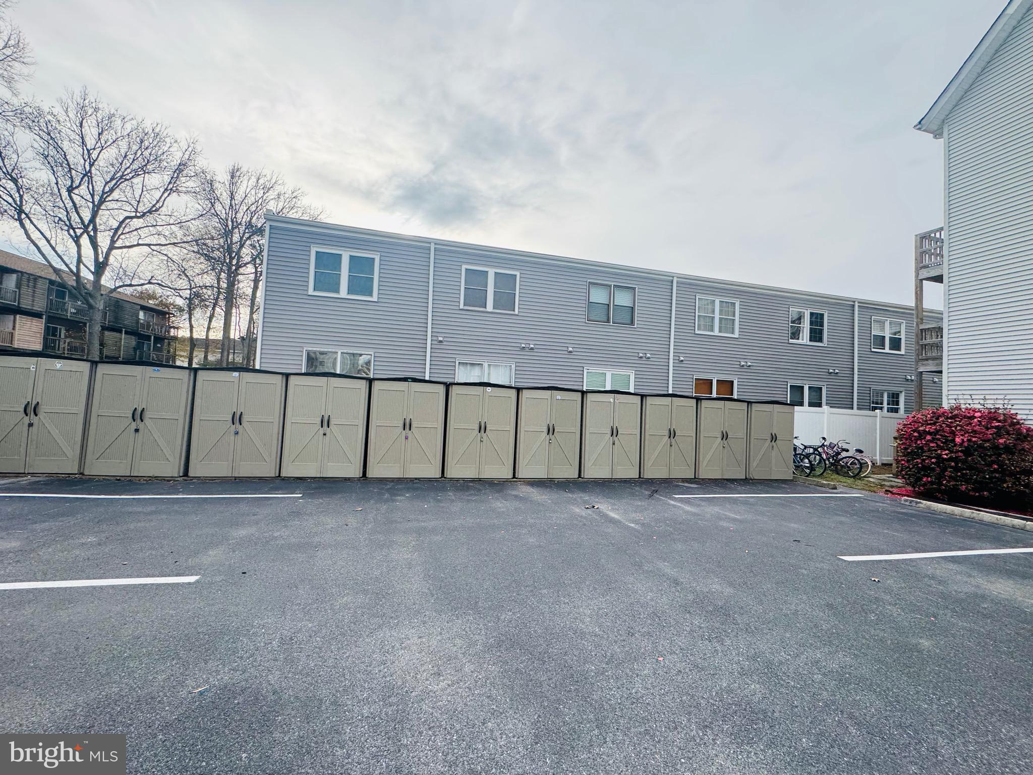 14400 Jarvis Avenue, Unit 113C Ocean City, MD 21842 - Photo 15 of 19 a view of a house with a fence