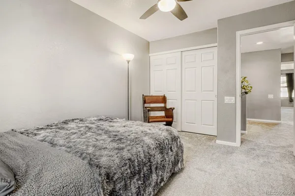 a bedroom with a bed and a cabinets