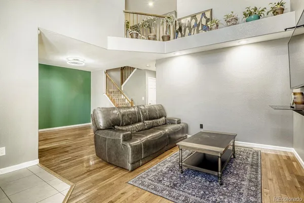 a living room with furniture and a rug