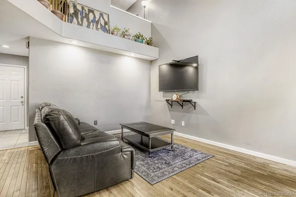 a living room with furniture and a rug