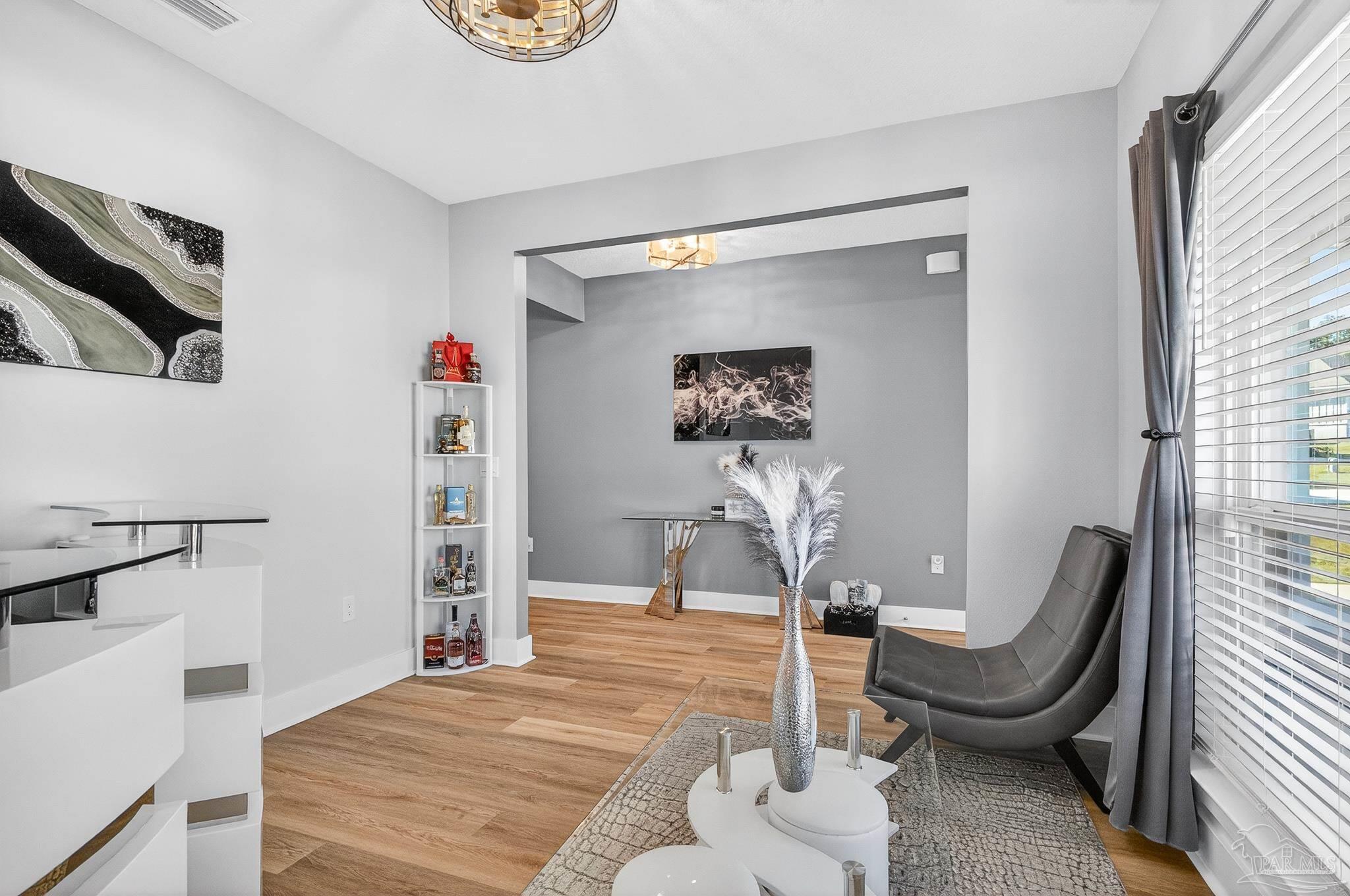 6076 Rutherford Loop Pensacola, FL 32526 - Photo 11 of 67 a living room with furniture a rug and white walls