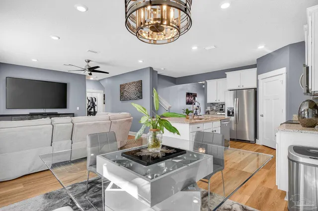 a living room with a table and chairs