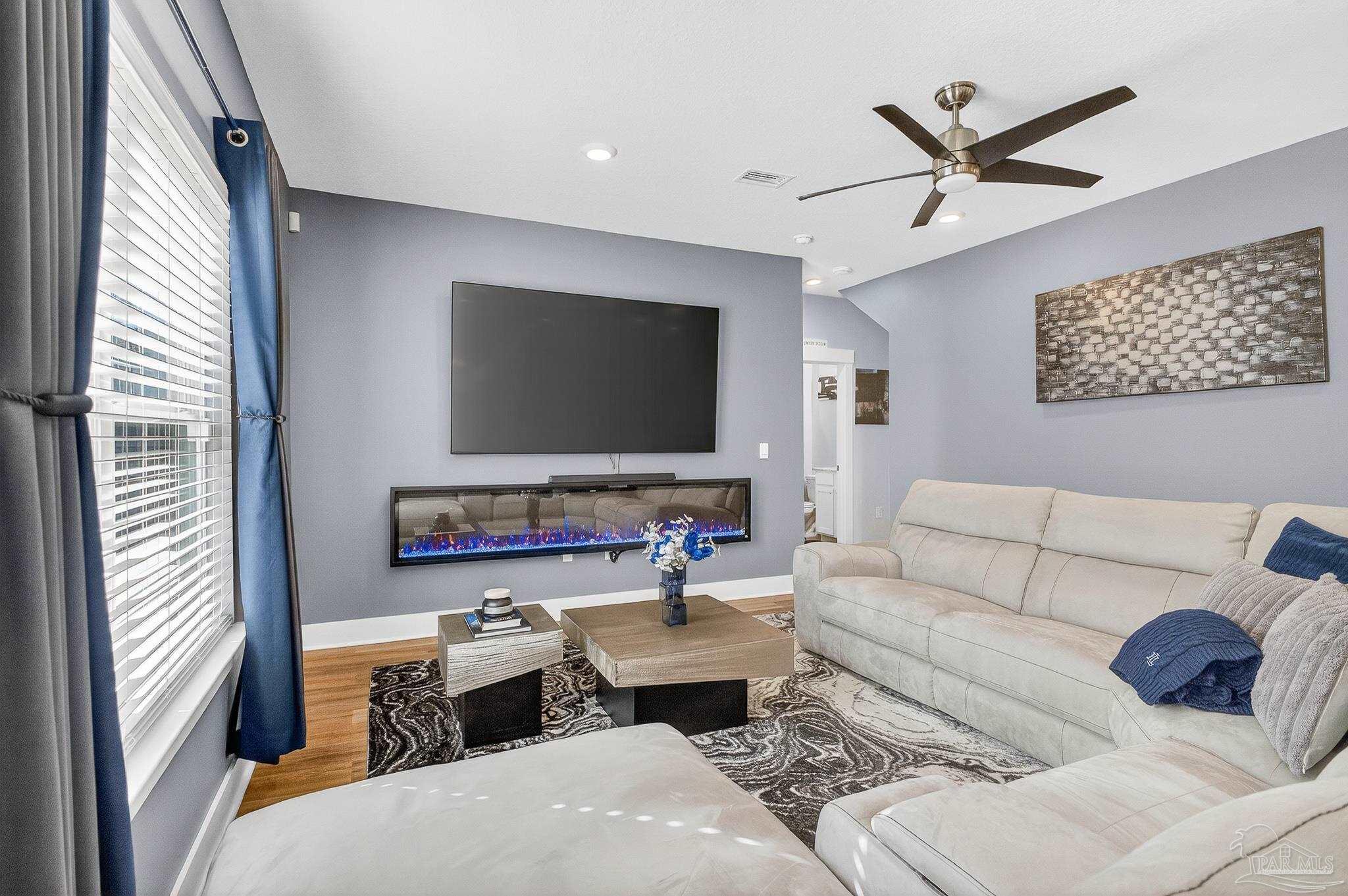 6076 Rutherford Loop Pensacola, FL 32526 - Photo 23 of 67 a living room with furniture and a flat screen tv