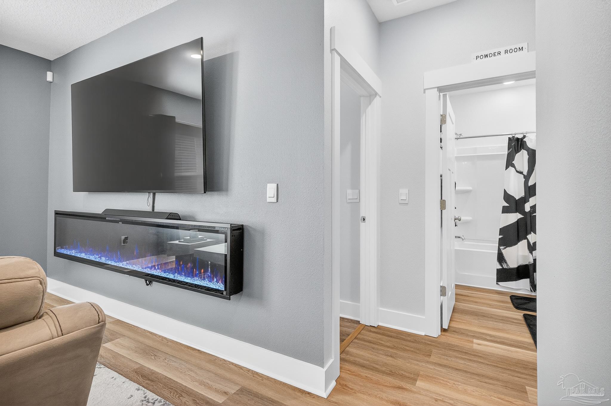 6076 Rutherford Loop Pensacola, FL 32526 - Photo 26 of 67 a living room with furniture and a flat screen tv