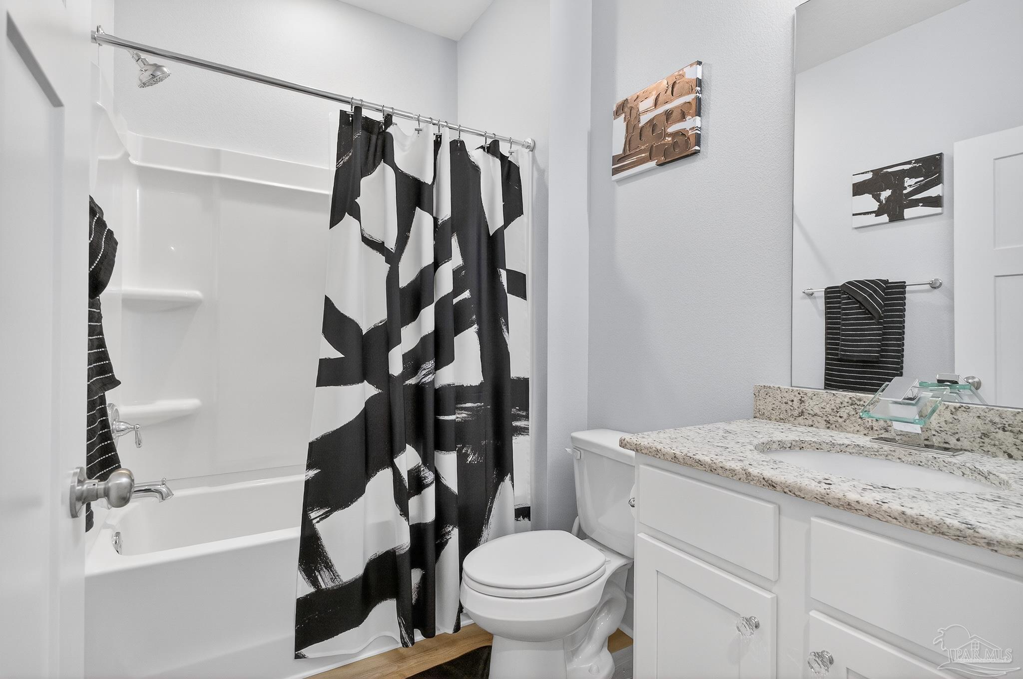 6076 Rutherford Loop Pensacola, FL 32526 - Photo 31 of 67 a bathroom with a granite countertop sink toilet and shower