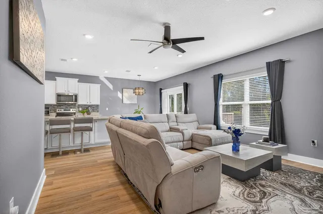 a bedroom with a bed and a night stand