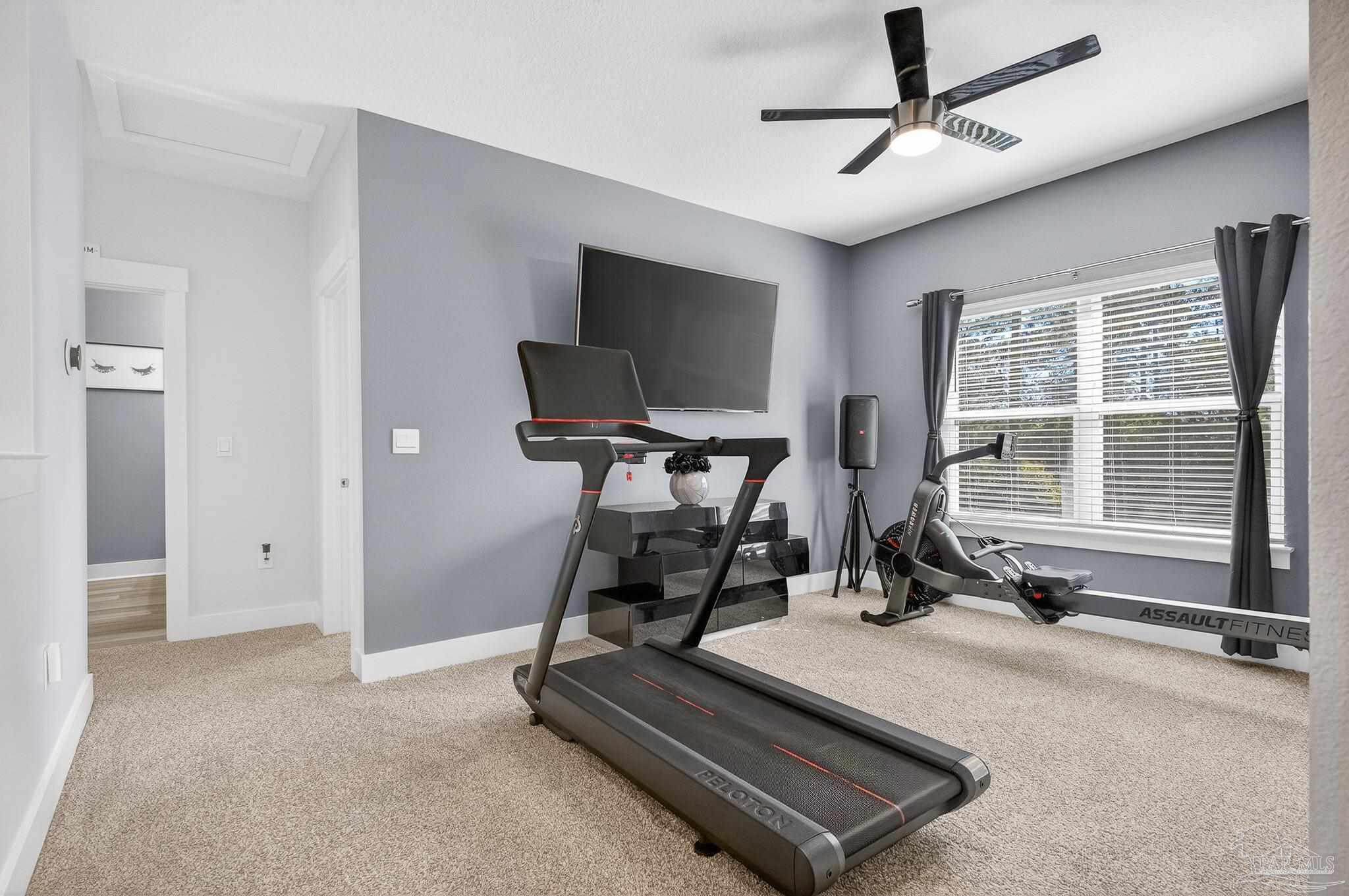 6076 Rutherford Loop Pensacola, FL 32526 - Photo 39 of 67 a view of a room with gym equipment
