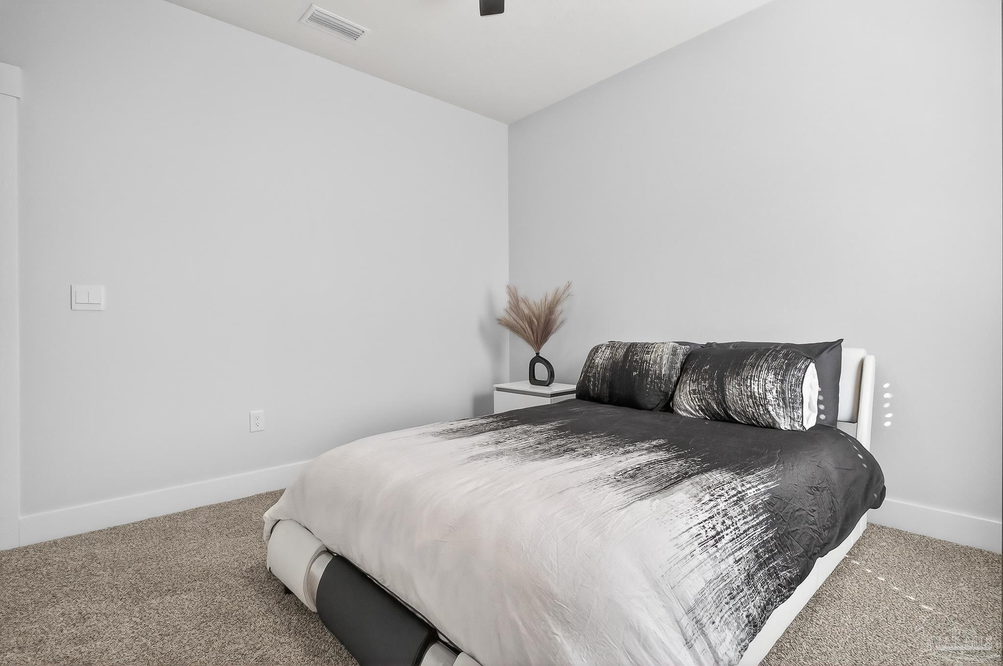 6076 Rutherford Loop Pensacola, FL 32526 - Photo 44 of 67 a large bed sitting in a bedroom next to a wall