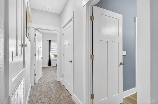 a spacious bedroom with a bed and a flat screen tv