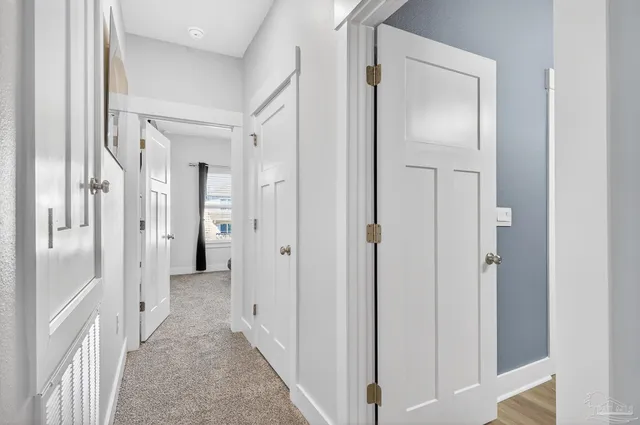 a spacious bedroom with a bed and a flat screen tv