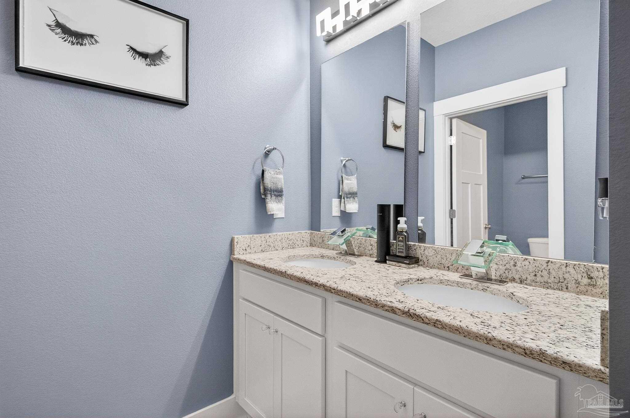 6076 Rutherford Loop Pensacola, FL 32526 - Photo 48 of 67 a bathroom with a granite countertop sink and a mirror