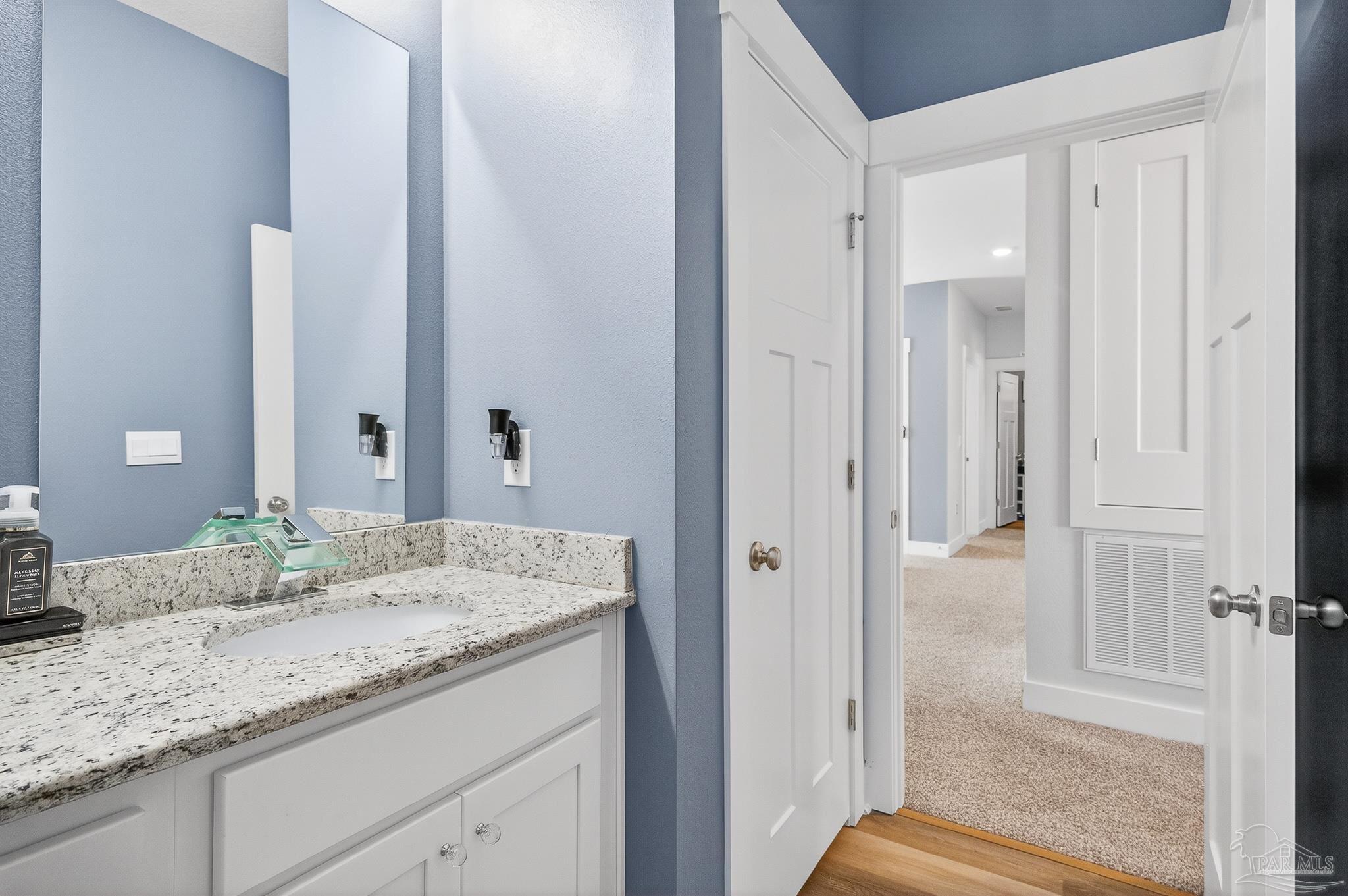 6076 Rutherford Loop Pensacola, FL 32526 - Photo 50 of 67 a bathroom with a granite countertop sink and a mirror