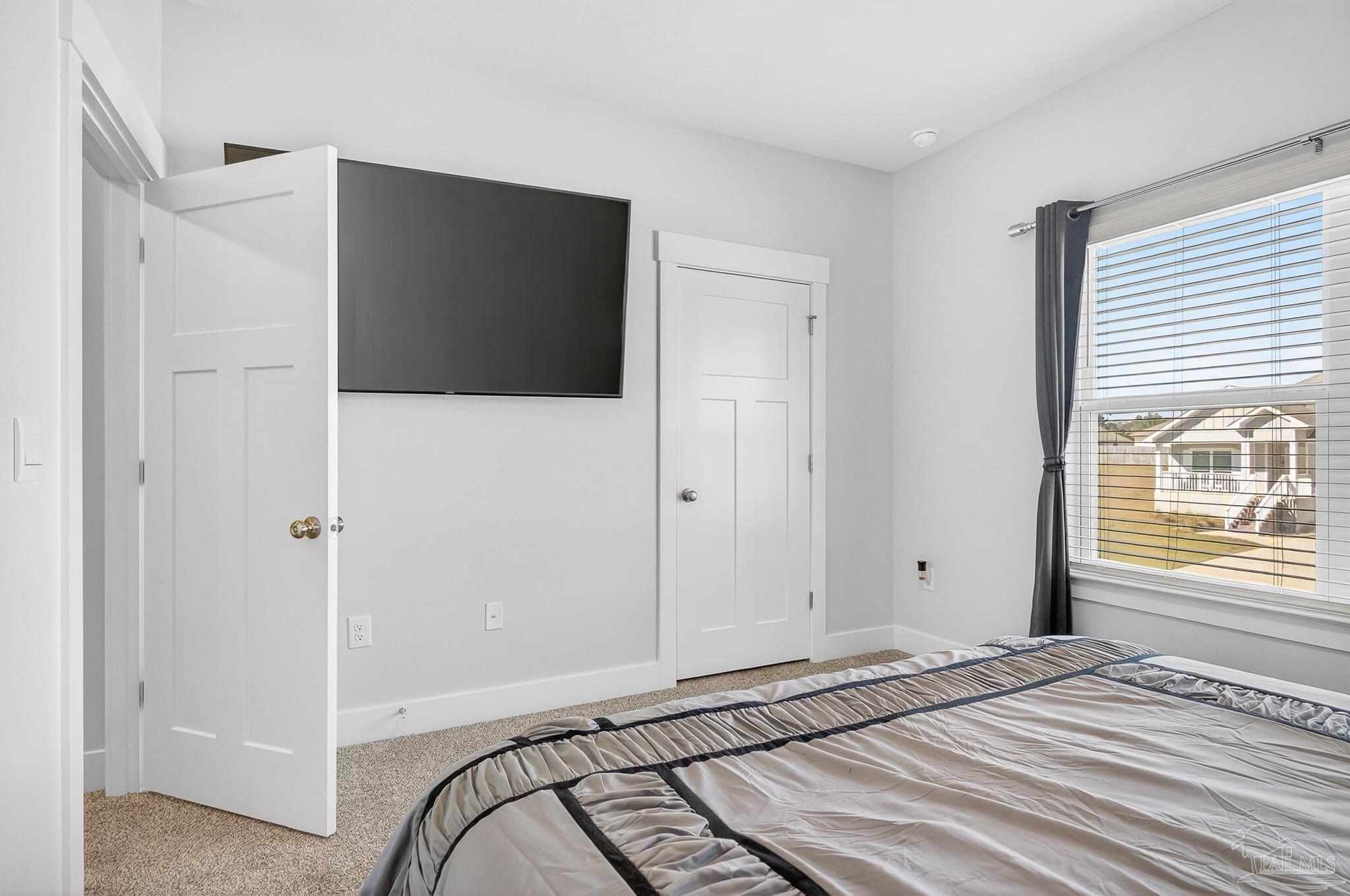 6076 Rutherford Loop Pensacola, FL 32526 - Photo 55 of 67 a view of a livingroom with wooden floor and windows