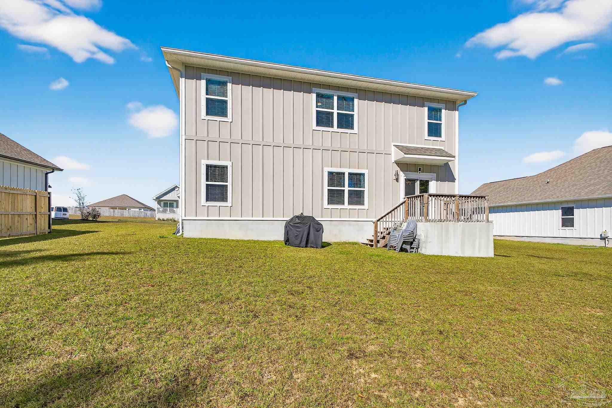 6076 Rutherford Loop Pensacola, FL 32526 - Photo 67 of 67 a front view of a house with a yard