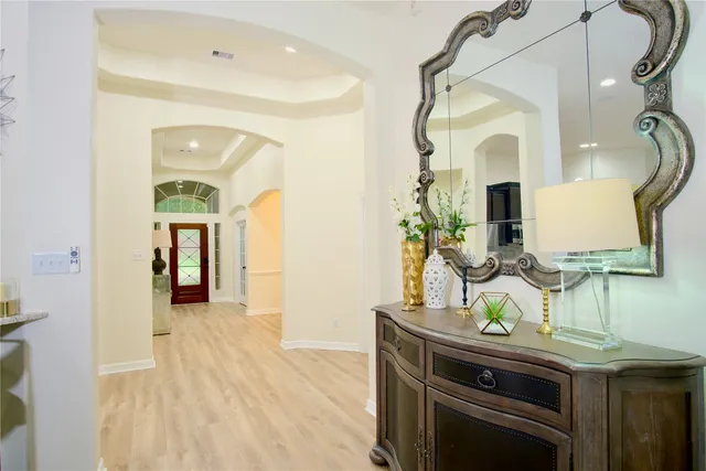 a view of living room with furniture and wooden floor