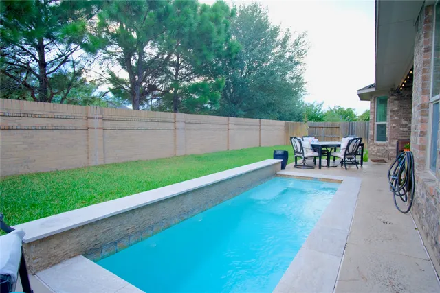 a view of a backyard with a patio