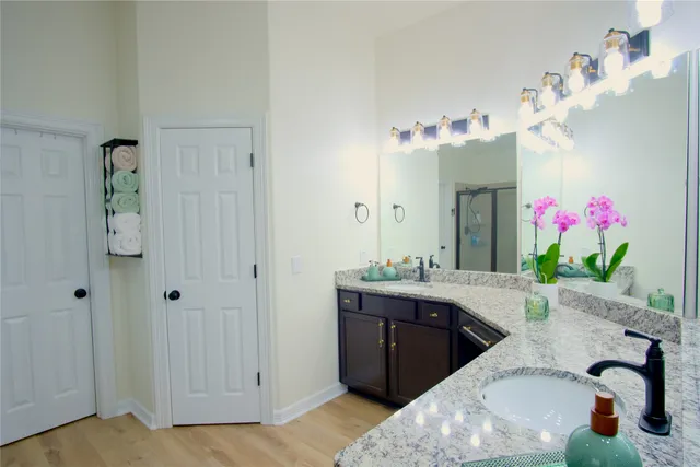 a bath room with a sink bath tub and a mirror