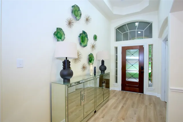 a view of hallway with wooden floor