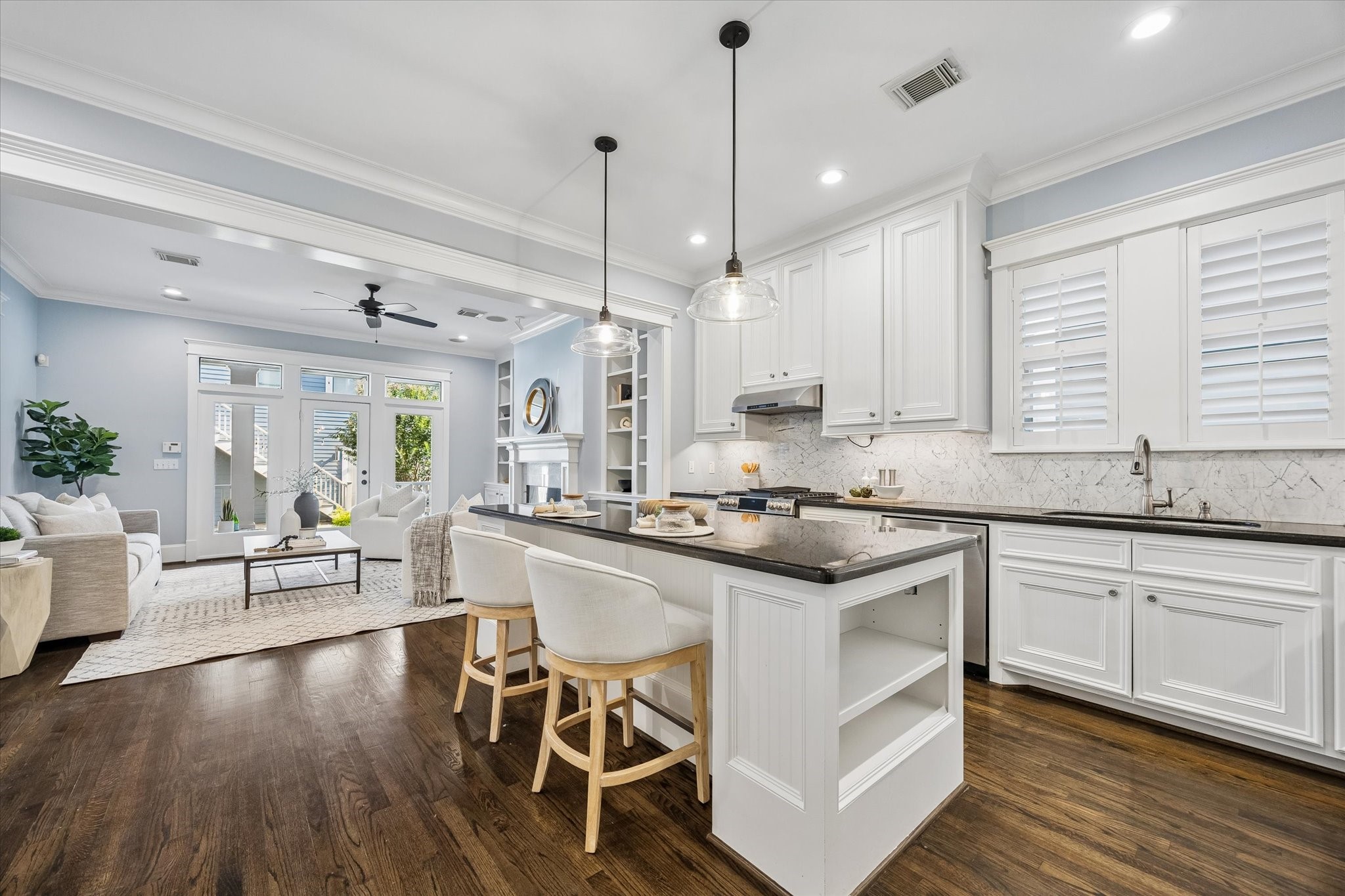 634 West 17th Street Houston, TX 77008 - Photo 12 of 42 This stunning island kitchen keeps everyone beautifully connected with bar seating, designer finishes, and plenty of space to cook, gather, and chat, all while flowing easily into the family room.