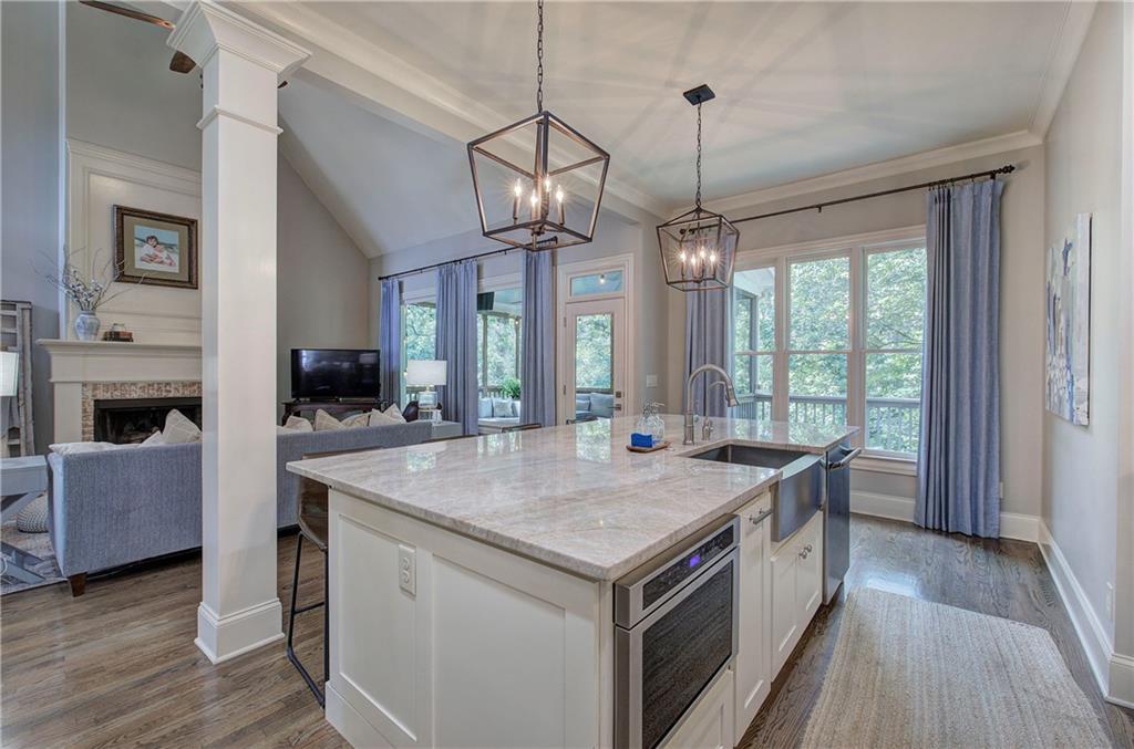 16 Cambridge Way Cartersville, GA 30121 - Photo 12 of 48 a view of a kitchen island a chandelier and wooden floor