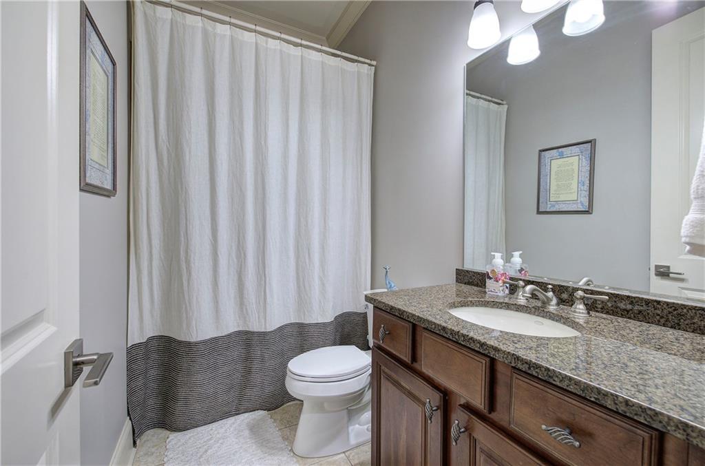 16 Cambridge Way Cartersville, GA 30121 - Photo 23 of 48 a bathroom with a granite countertop sink and a mirror with toilet