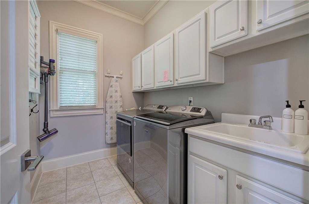 16 Cambridge Way Cartersville, GA 30121 - Photo 24 of 48 a kitchen with stainless steel appliances granite countertop a sink stove and cabinets