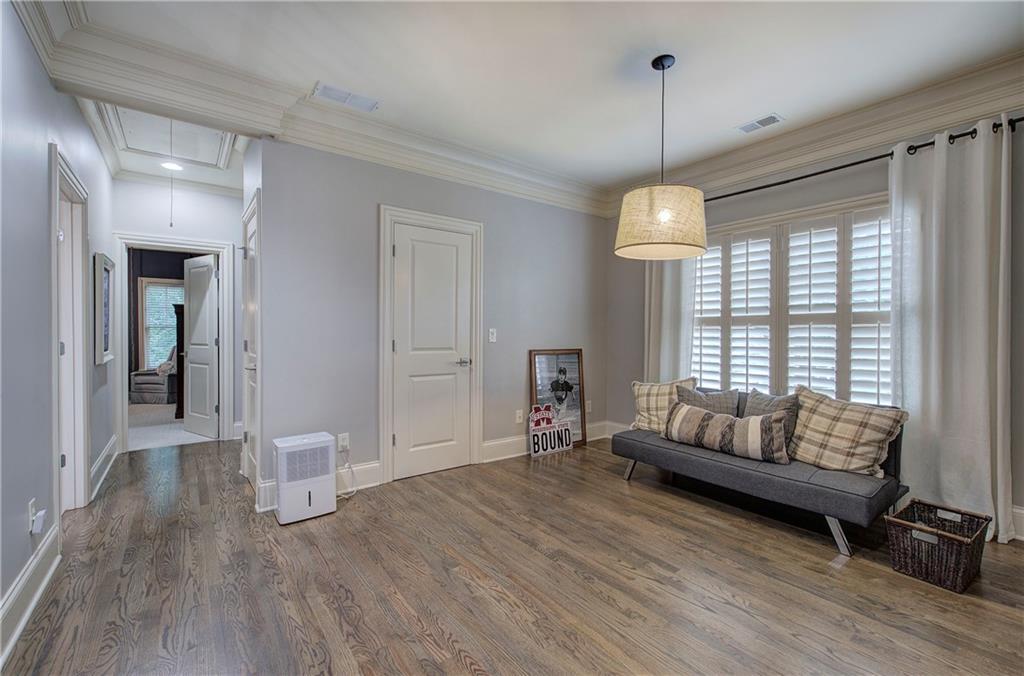 16 Cambridge Way Cartersville, GA 30121 - Photo 26 of 48 a living room with furniture and a chandelier