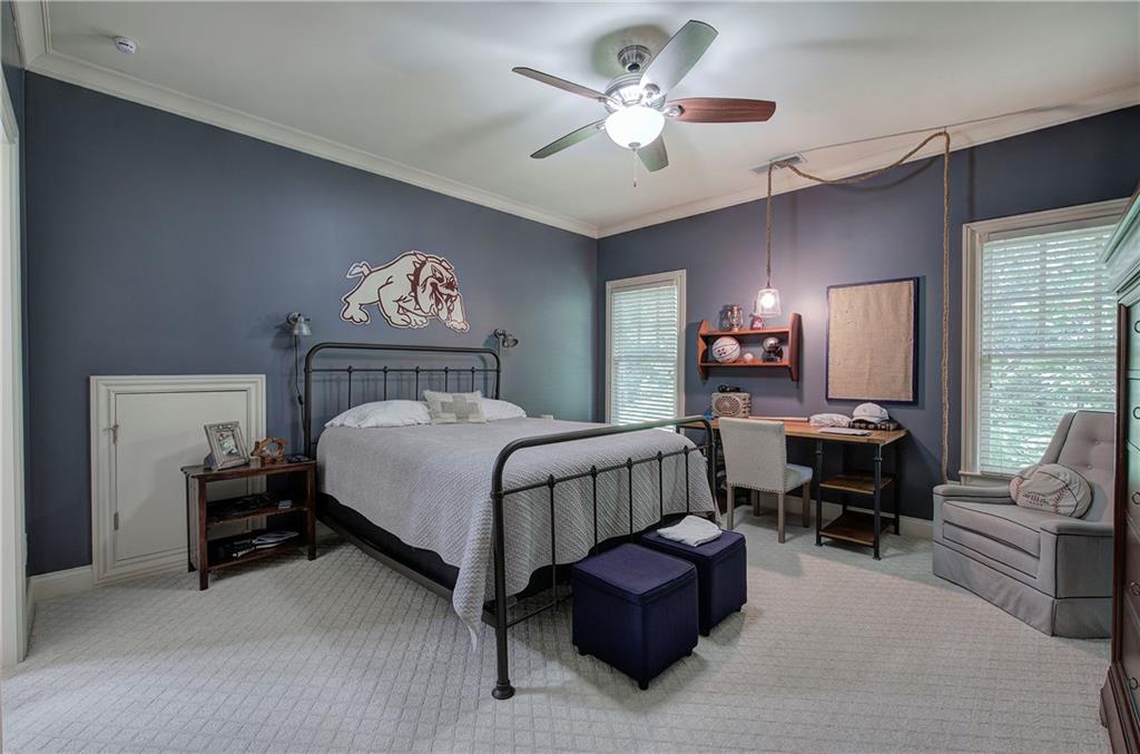 16 Cambridge Way Cartersville, GA 30121 - Photo 30 of 48 a spacious bedroom with a bed couch chandelier and a window