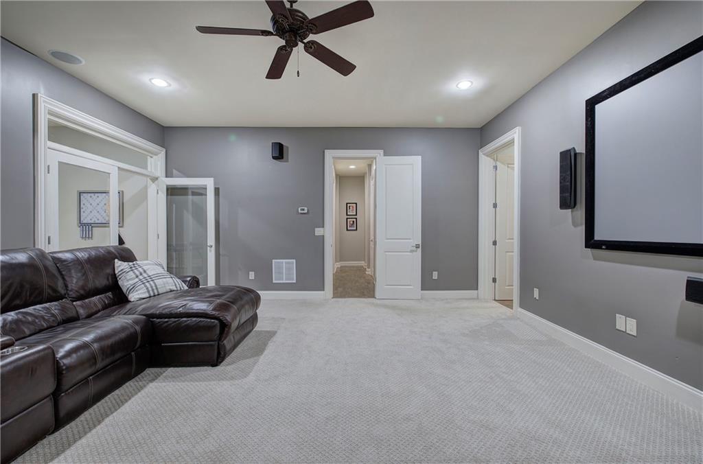 16 Cambridge Way Cartersville, GA 30121 - Photo 35 of 48 a living room with furniture and a ceiling fan