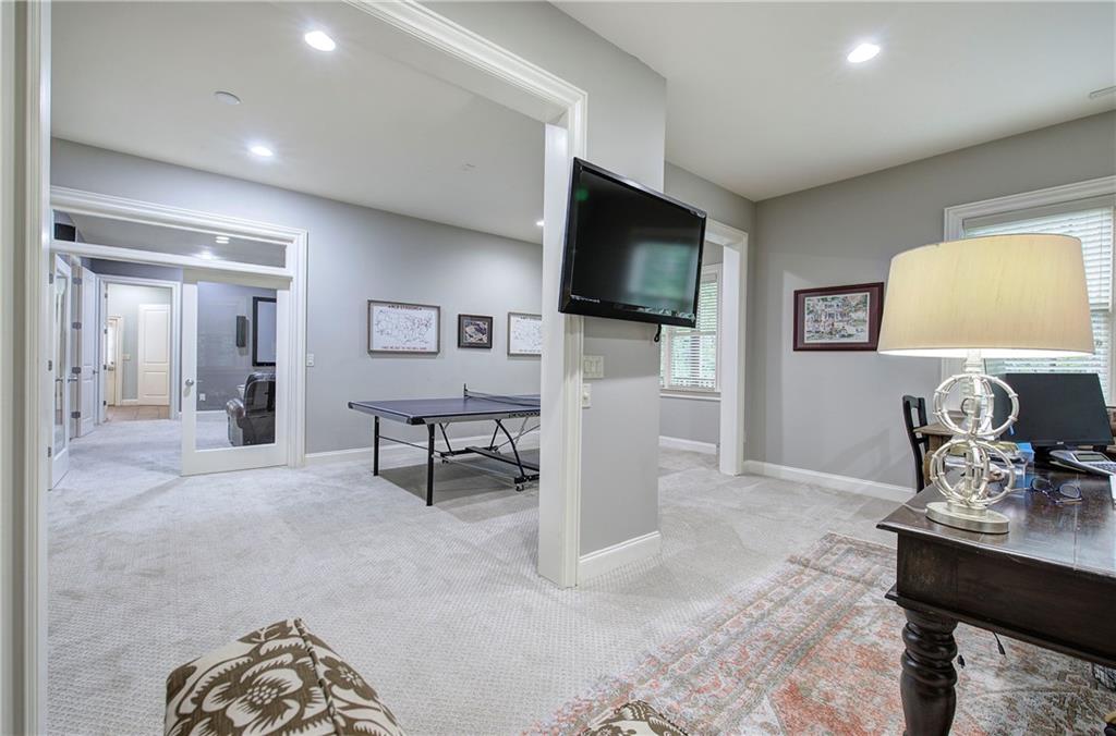 16 Cambridge Way Cartersville, GA 30121 - Photo 40 of 48 a living room with furniture and a flat screen tv