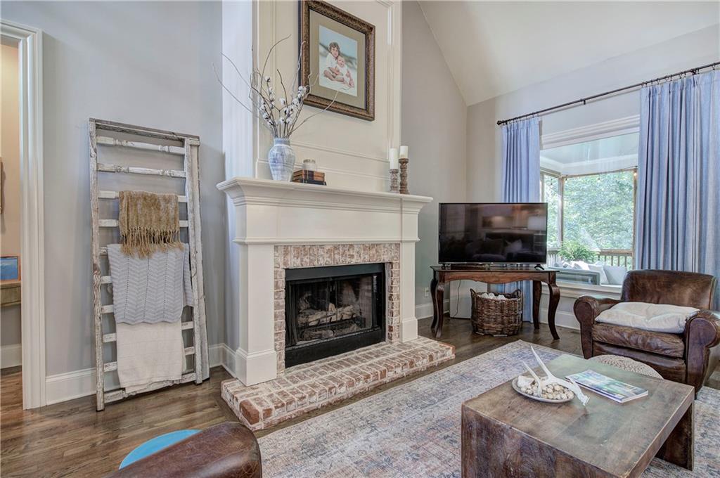 16 Cambridge Way Cartersville, GA 30121 - Photo 7 of 48 a living room with furniture a flat screen tv and a fireplace