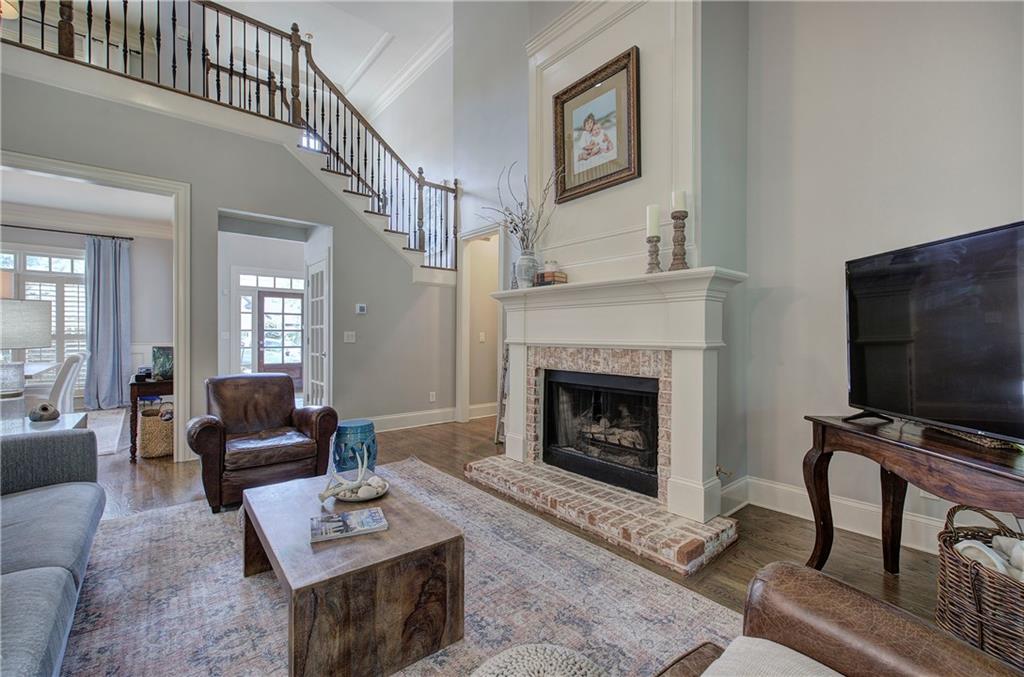 16 Cambridge Way Cartersville, GA 30121 - Photo 8 of 48 a living room with furniture a flat screen tv and a fireplace