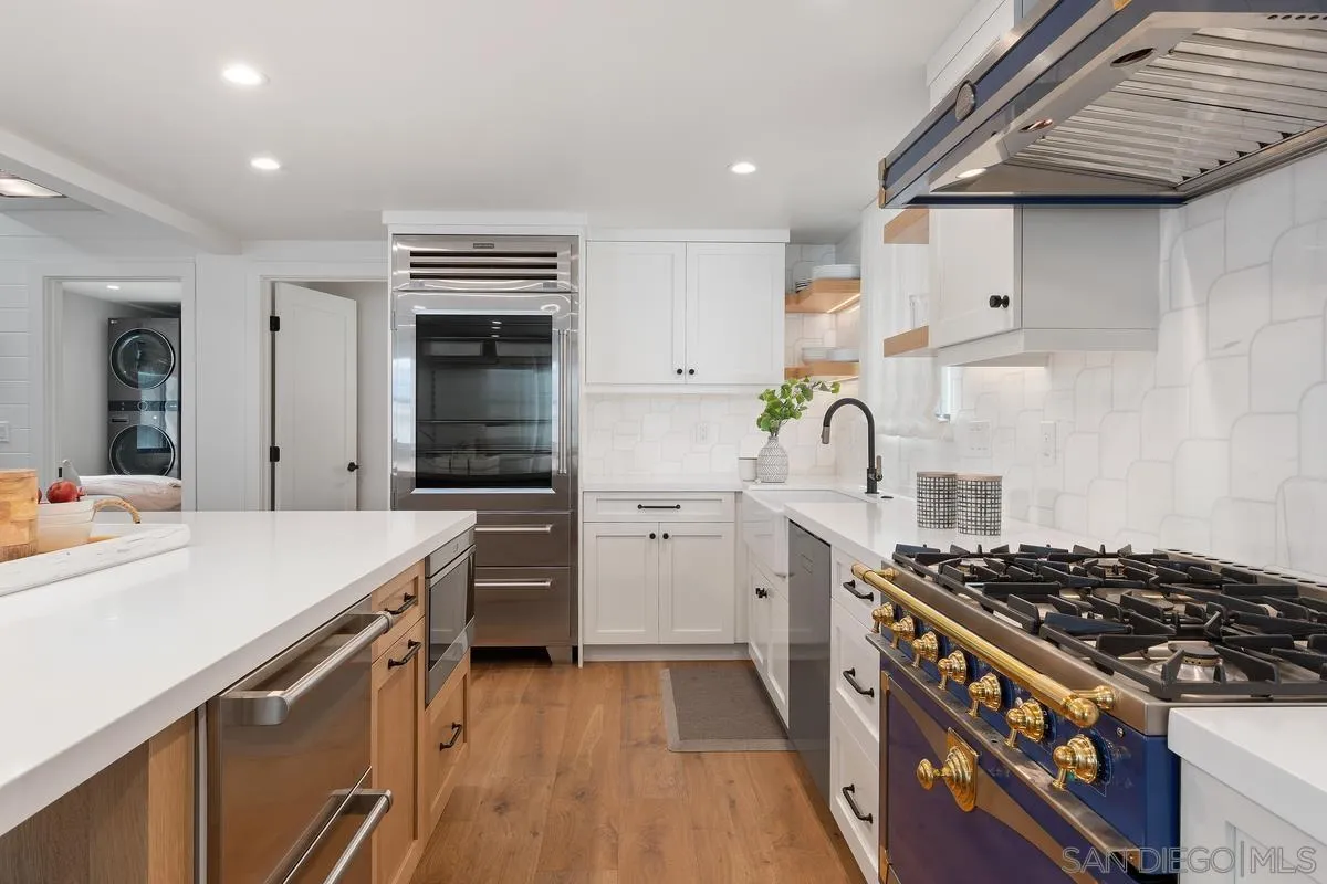 123 Jasper Street, Unit 29 Encinitas, CA 92024 - Photo 4 of 19 a kitchen with a stove and a refrigerator