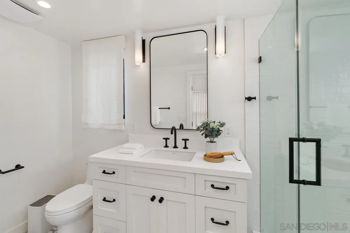 123 Jasper Street, Unit 29 Encinitas, CA 92024 - Photo 10 of 19 a bathroom with a sink and a mirror