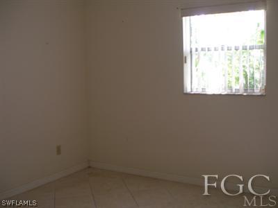 7317 Jonas Road Fort Myers, FL 33967 - Photo 6 of 10 an empty room with windows
