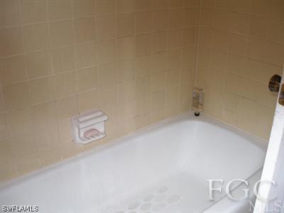 7317 Jonas Road Fort Myers, FL 33967 - Photo 8 of 10 a utility room with a door