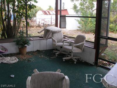 7317 Jonas Road Fort Myers, FL 33967 - Photo 9 of 10 a patio with table and chairs