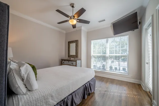 a bedroom with a large bed and a large window