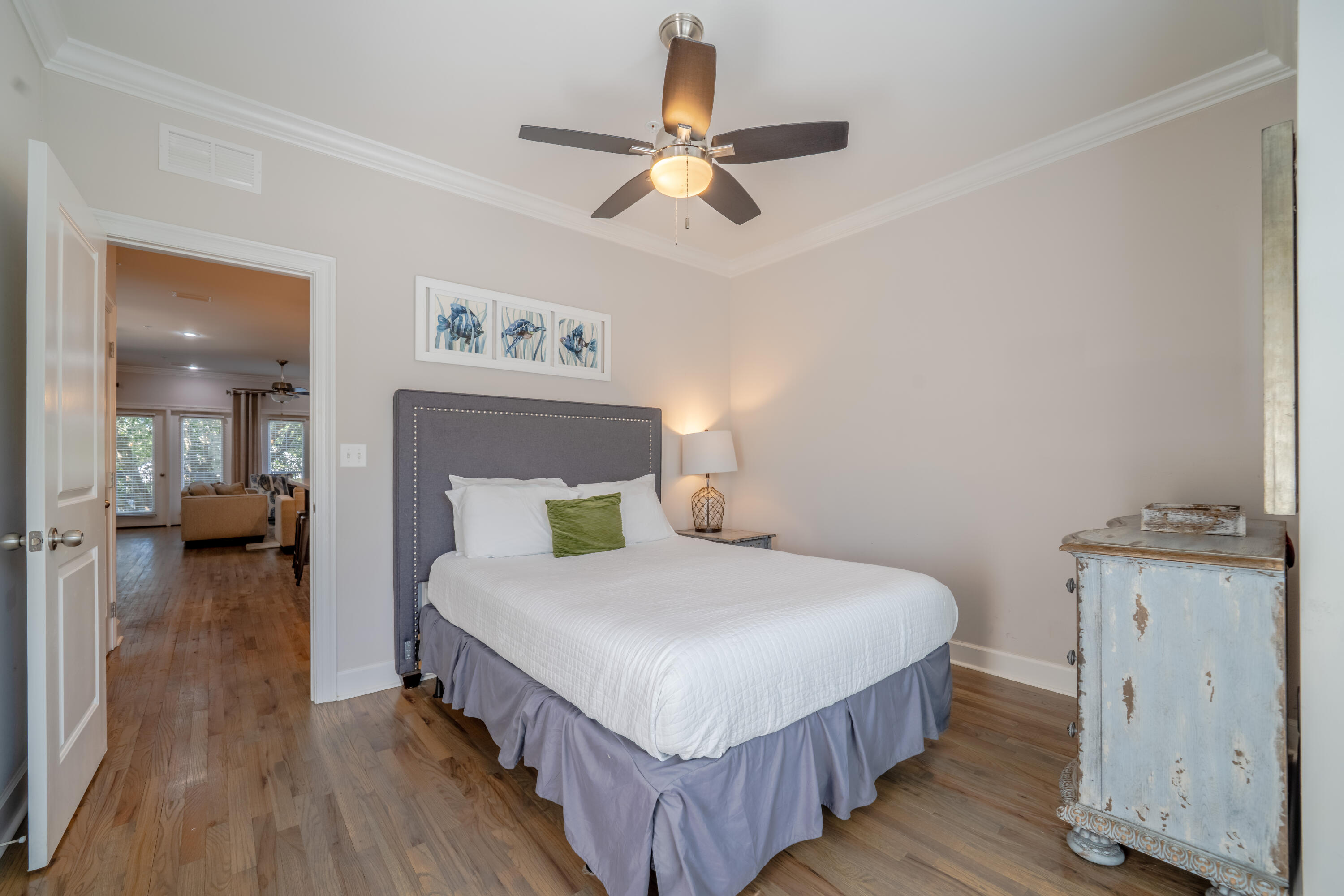 257 Driftwood Road, Unit 2 Miramar Beach, FL 32550 - Photo 19 of 35 a bedroom with a bed and a chandelier