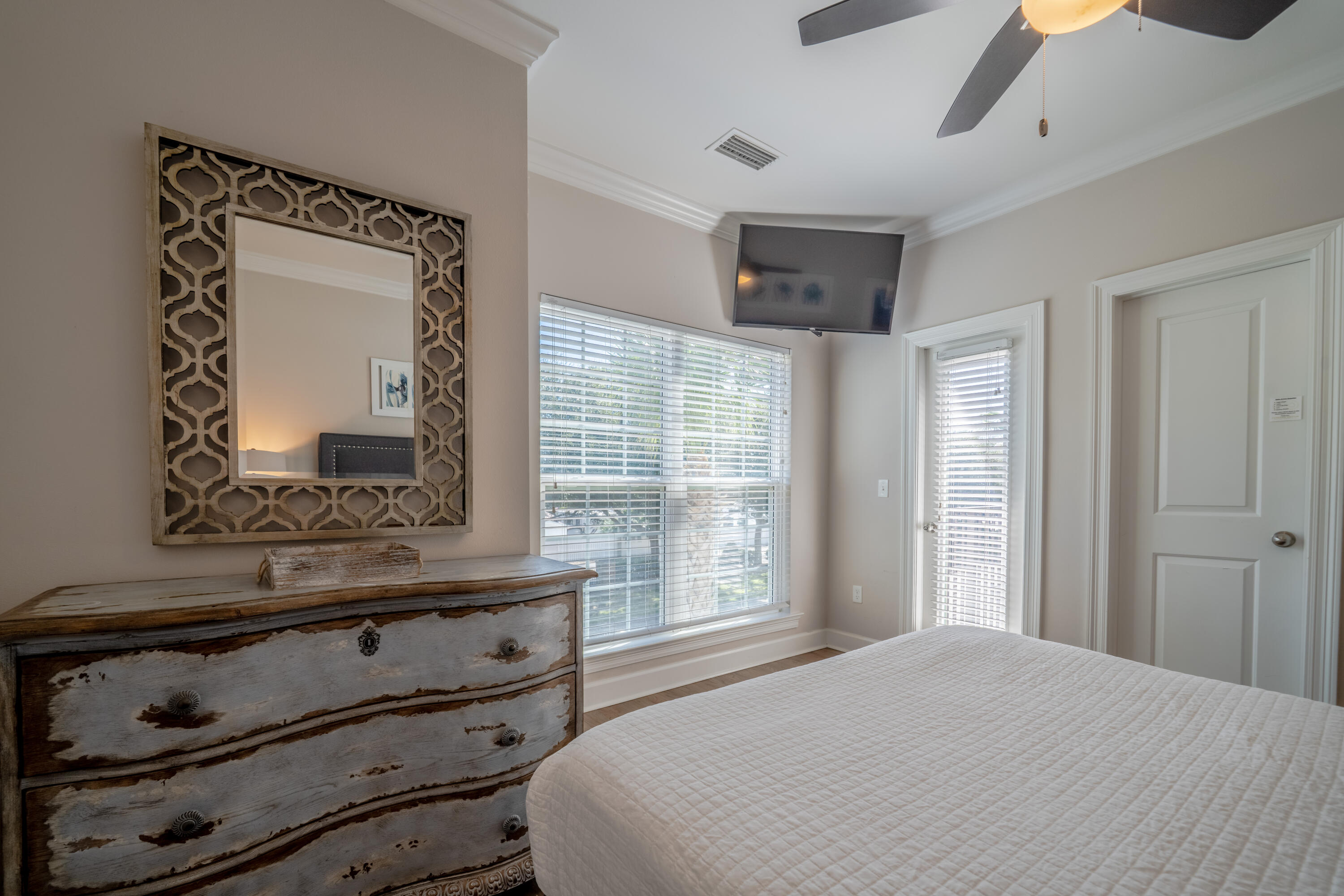 257 Driftwood Road, Unit 2 Miramar Beach, FL 32550 - Photo 20 of 35 a bedroom with a bed and a mirror