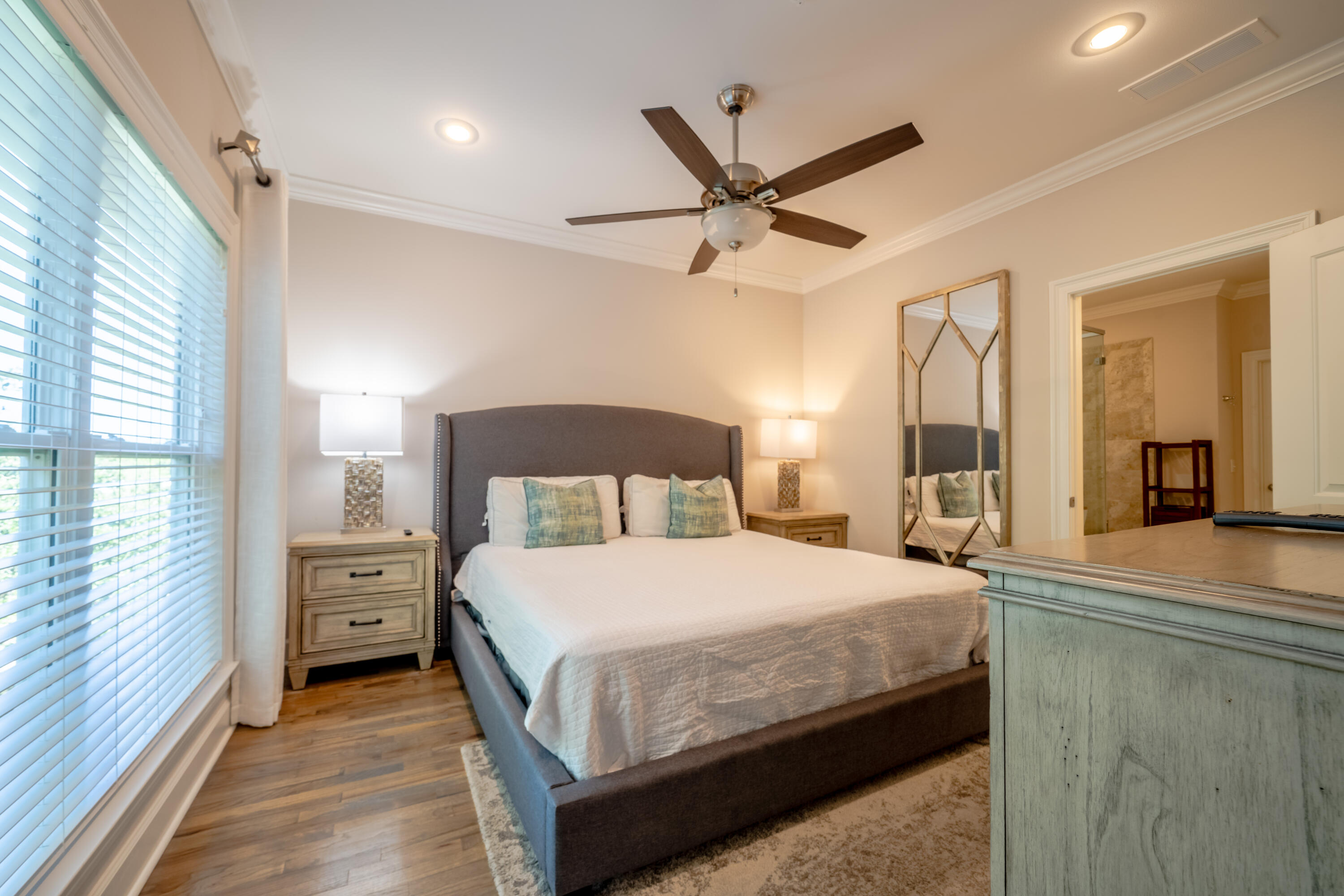 257 Driftwood Road, Unit 2 Miramar Beach, FL 32550 - Photo 23 of 35 a bedroom with a bed and a chandelier