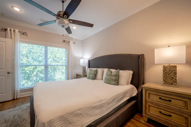 a bedroom with a large bed and a window