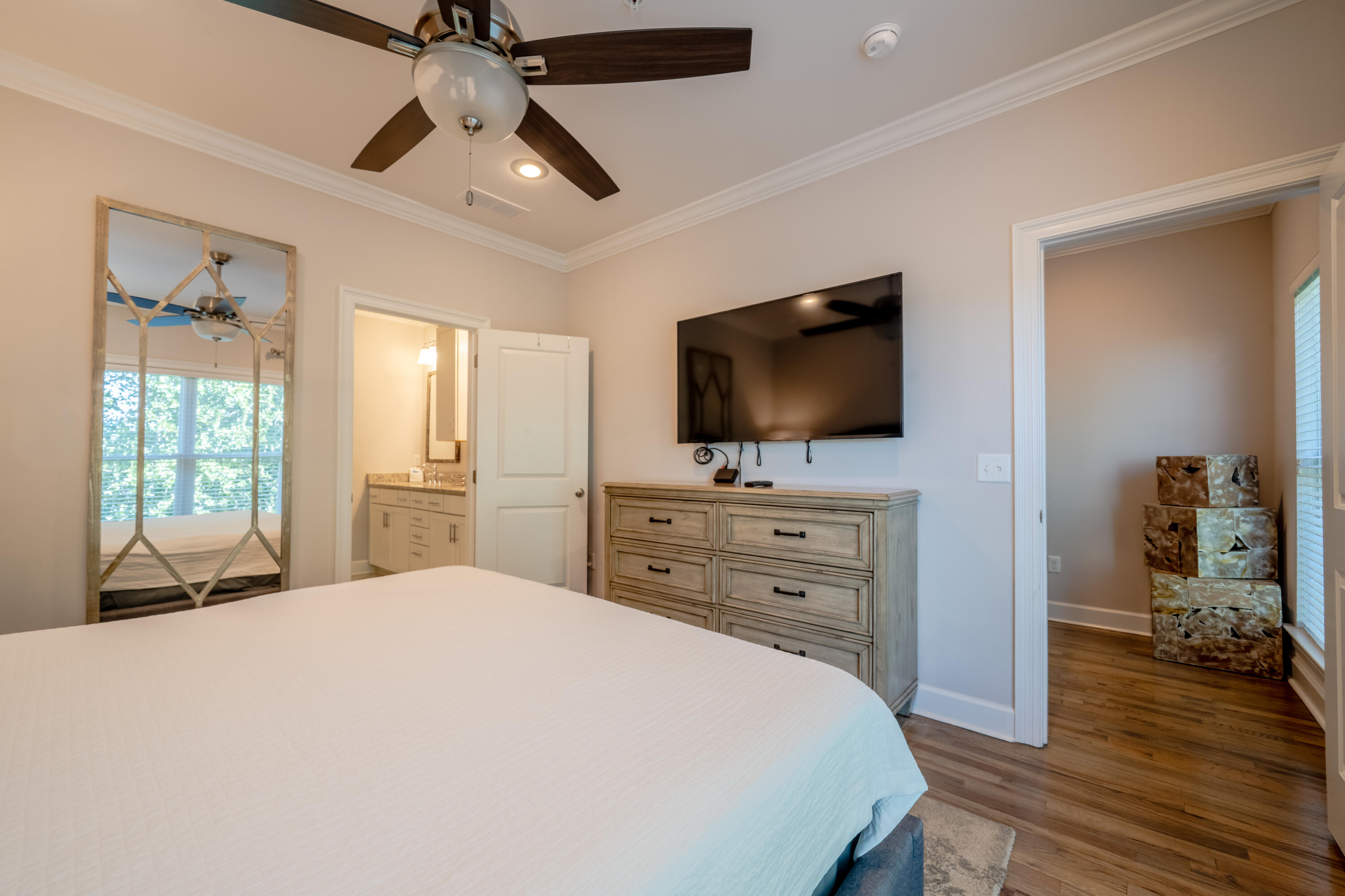 257 Driftwood Road, Unit 2 Miramar Beach, FL 32550 - Photo 25 of 35 a bedroom with a bed and a flat screen tv