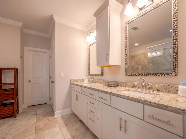 a bathroom with a granite countertop sink mirror and