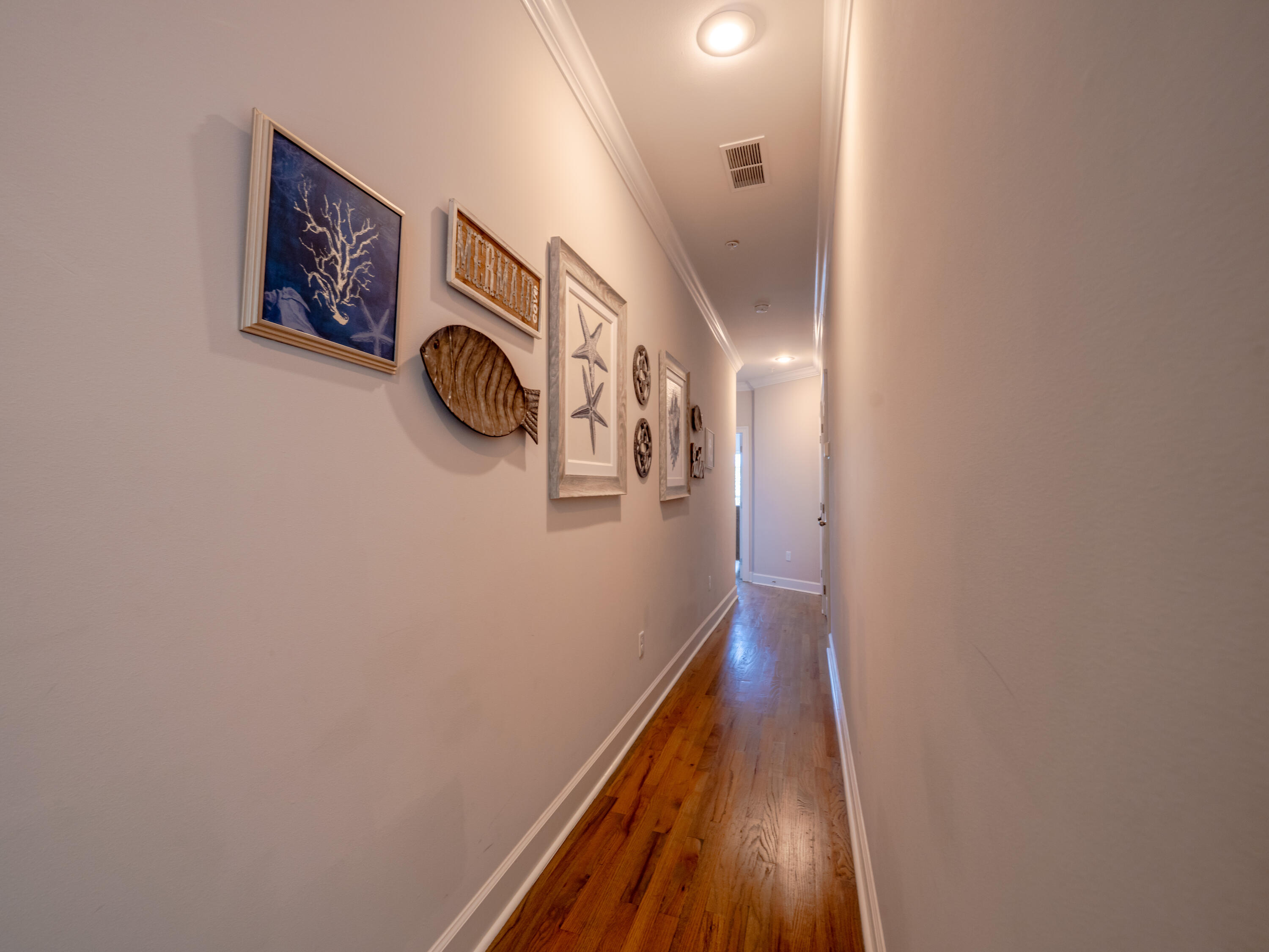 257 Driftwood Road, Unit 2 Miramar Beach, FL 32550 - Photo 29 of 35 a view of a hallway with wooden walls