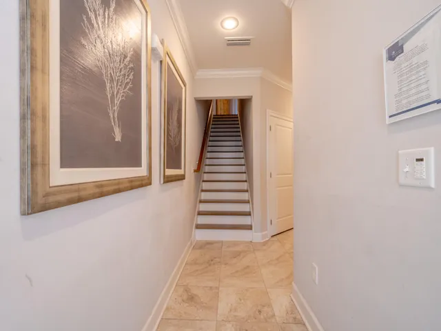 a view of a hallway with stairs